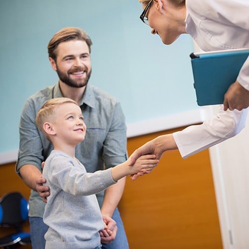 Child Shaking Doctors Hand Child Shaking Doctors Hand